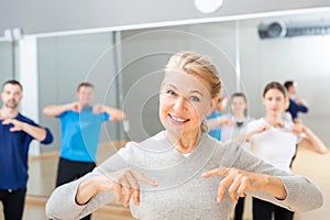 Mature woman practicing vigorous dance