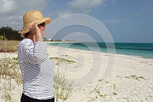 Mature woman in profle looks out at sea