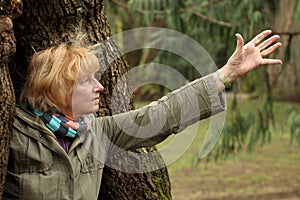 Mature woman reaching out