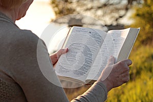 Mature woman reading bible