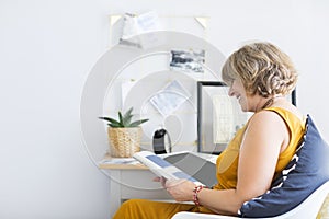 Mature woman reading book