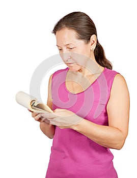 Mature woman reads notebook