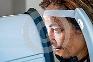 Mature woman receiving an innovative a laser treatment for glaucoma