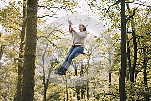 Mature Woman on a Rope Swing
