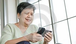 Mature woman searching pills in internet