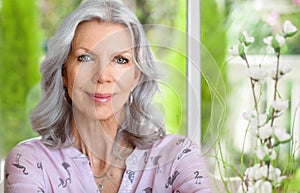 Mature woman sitting in the winter garden