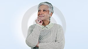Mature woman, smile and thinking of question in studio by blue background. Happy mexican person, strategy and planning