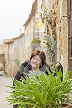 Mature woman smiling on her vacation, Monells, Catalonia, Spain photo