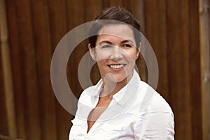 Mature woman smiling outside