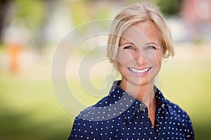 Mature woman smiling. Outside