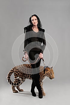 Mature woman and spotty leopard