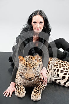 Mature woman and spotty leopard