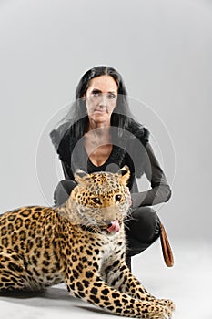 Mature woman and spotty leopard