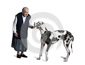 Mature woman standing with great Dane dog