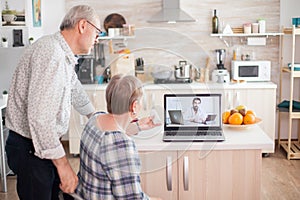 Mature woman talking with doctor