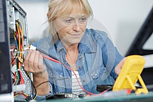 mature woman testing motherboard