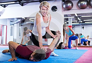 Mature woman training with coach