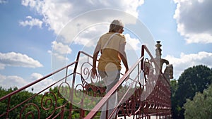 Mature woman traveling on rural historic places. Slavic traditional pottery culture in Ukraine. Active lifestyle