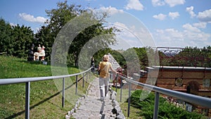 Mature woman traveling on rural historic places. Slavic traditional pottery culture in Ukraine. Active lifestyle