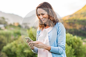 Mature woman using cellphone