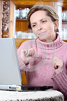 Mature woman using laptop