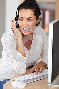 mature woman working in call center