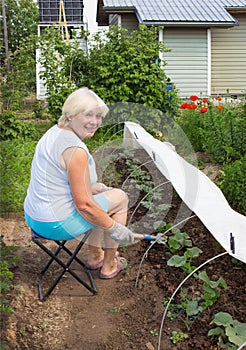 Mature woman working in her garden