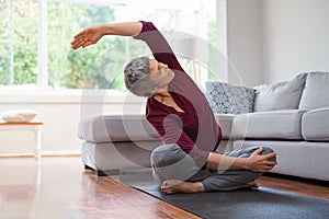 Mature woman in yoga pose