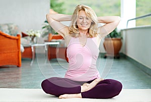 Mature woman in yoga position