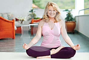 Mature woman in yoga position