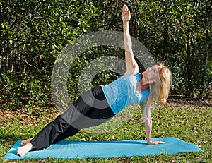 Mature Woman Yoga - Side Staff Asana photo