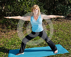 Mature Woman Yoga - Warrior Pose