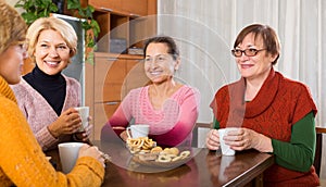 Mature women drinking tea