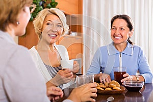Mature women having coffee break