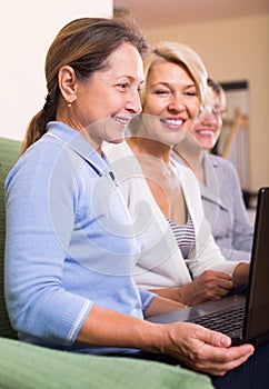 Mature women working with documents