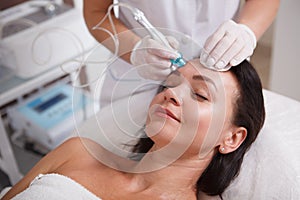 Mature womn getting facial skincare treatment