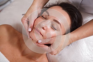 Mature womn getting facial skincare treatment