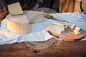 Matured cheese on wooden cutting board