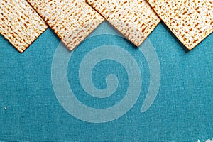 Matzah on blue background. Pesach celebration concept