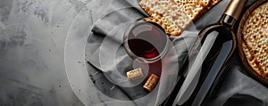 Matzah and red kosher wine on stone background. Passover celebration concept. Jewish Pesach holiday