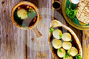 Matzo balls with broth. Jewish traditional cuisine. Matzo ball soup for passover photo