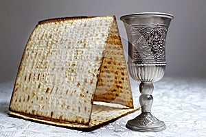 Matzo Matzah and vintage wine glass. Symbolic foods for Jewish Passover. Passover Pesach or Pesah - Jewish holiday