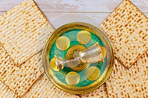 Matzo for Passover on metal seder tray on table