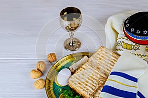 Matzo for Passover with metal tray and wine on table