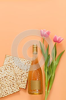 Matzo with tulips flowers and a bottle of wine. Pesach