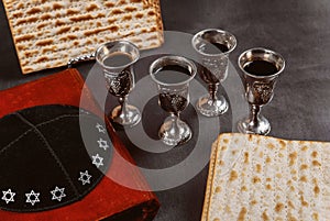 Matzoh jewish passover bread in the traditional seder plate with kipah