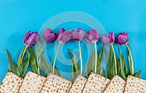 Matzos and flowers on the blue background