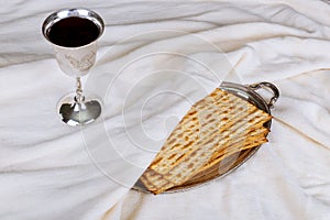 matzot, red wine and silver dish