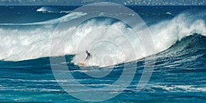 MAUI, HAWAII, USA - DECEMBER 10, 2013: Surfers are riding waves