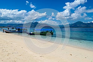 Maumere - An idyllic beach with boats anchored on the shore photo